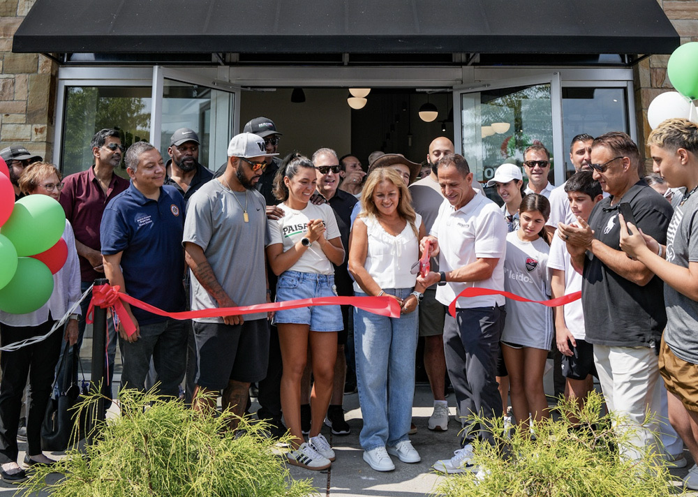 Cutting the ribbon at a Paisano’s grand opening