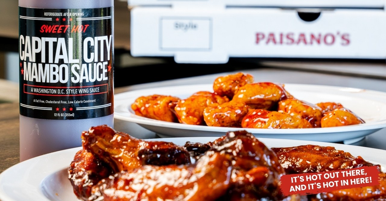 Sweet hot Capital City mambo sauce wings with a bottle of sauce