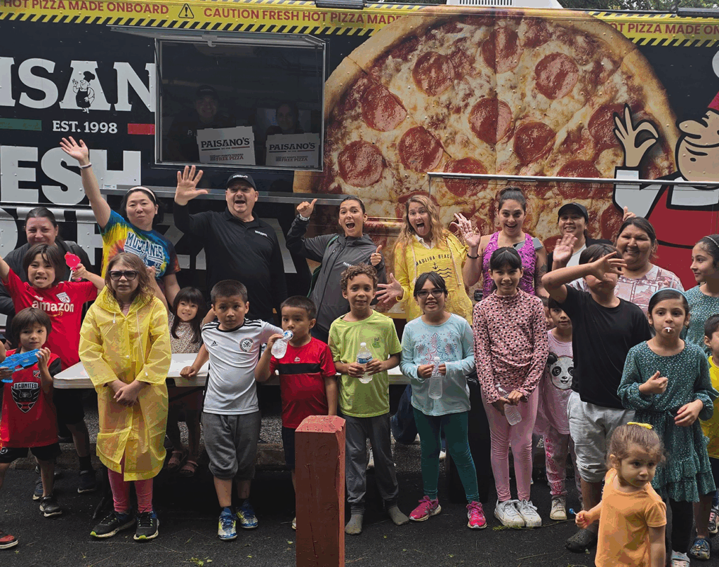 How it began — kids enjoying Paisano's food truck meals