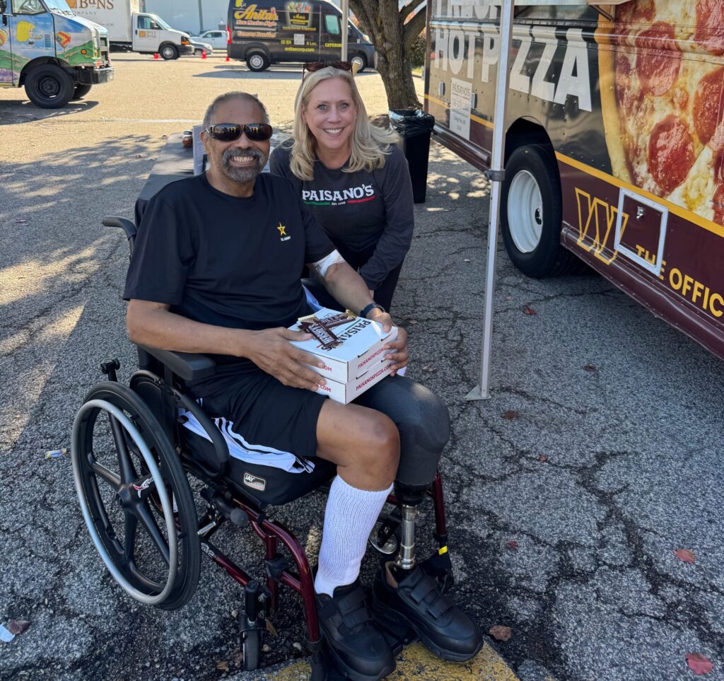 A veteran receiving a meal at the Paisano's food truck